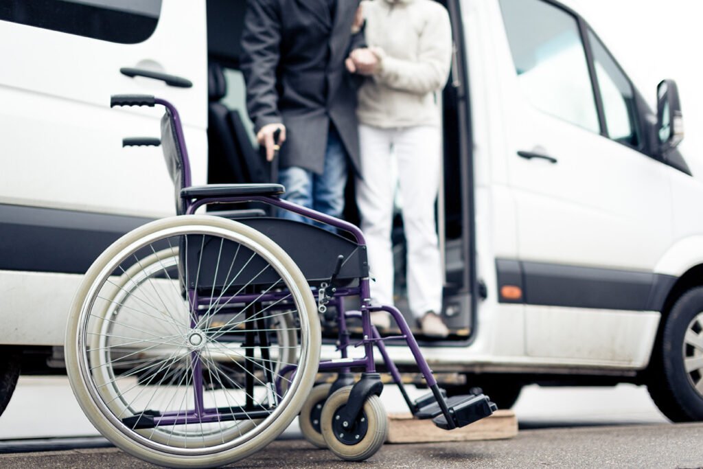 a person standing next to a wheelchair