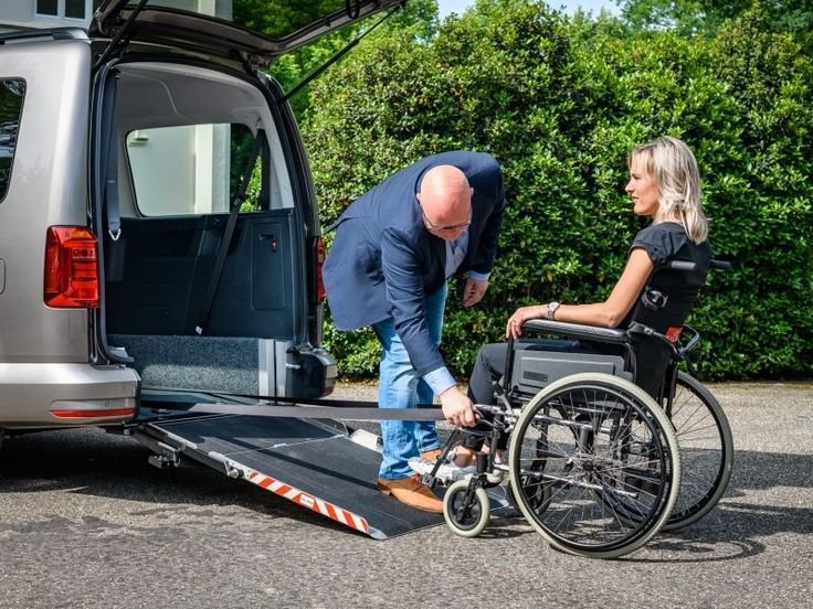 a person helping a person in a wheelchair