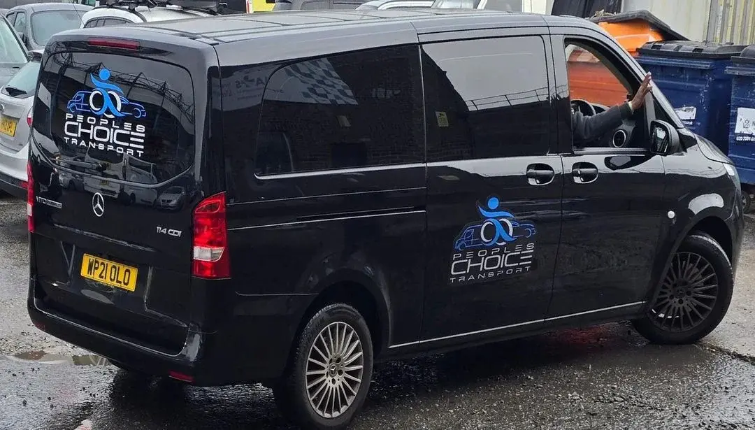 a black van with a person in the back