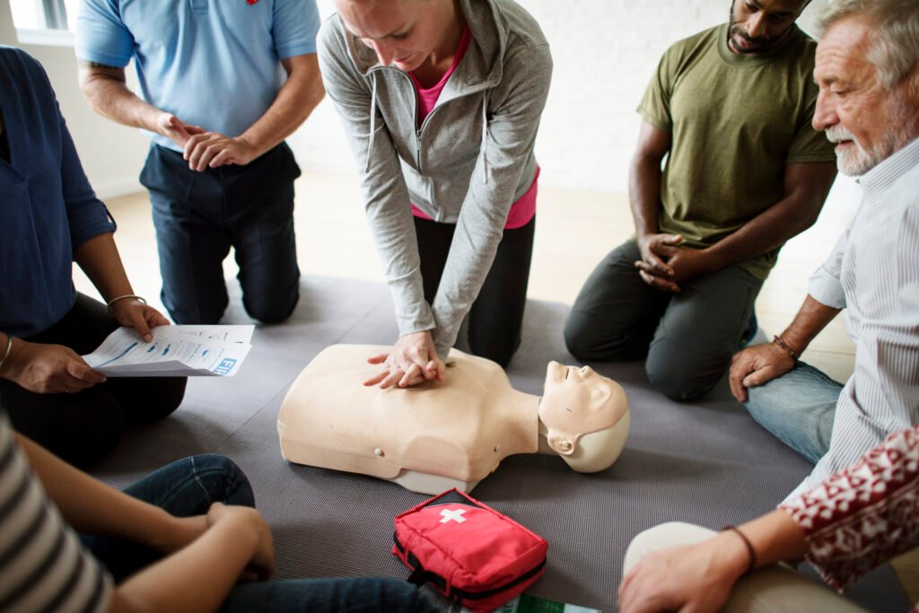 a group of people looking at a cpr