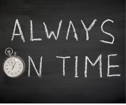 a stopwatch and a clock on a blackboard